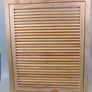 A wooden cabinet with slats on the front and back.