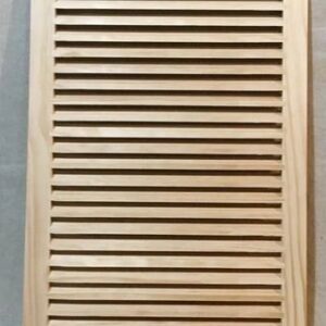 A wooden door with slats on the top of it.