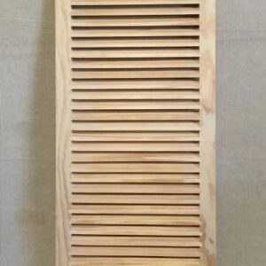 A wooden door with slats on the top of it.