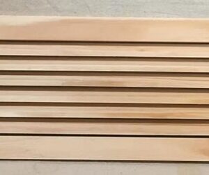 A wooden slat on the side of a wall.