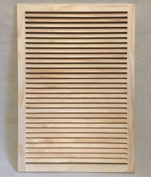 A wooden slat wall with no holes.