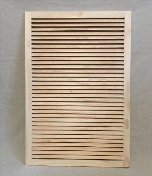 A wooden slat wall hanging on the side of a wall.