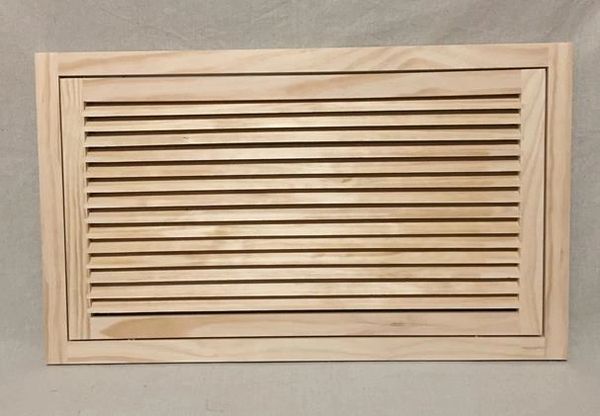 A wooden slat on the wall with some lines