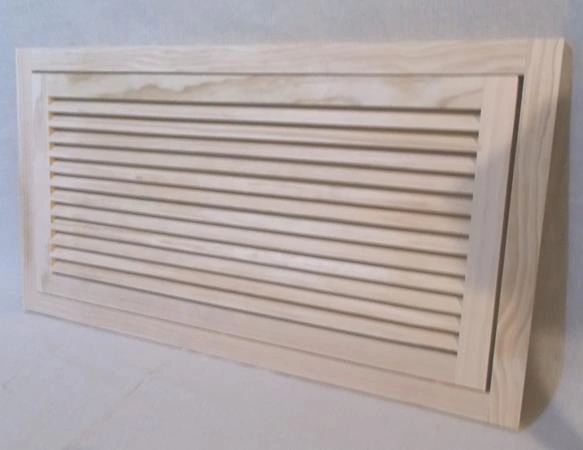 A wooden air vent on the wall