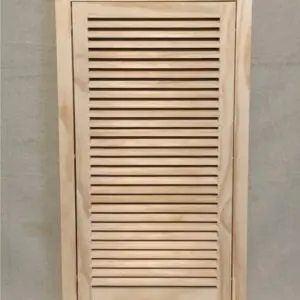 A wooden cabinet with a louvered door.