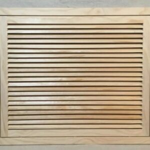 A wooden air vent with no frame on it.