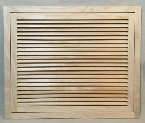 A wooden air vent with no frame on it.