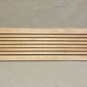 A wooden slat on the floor of a room.