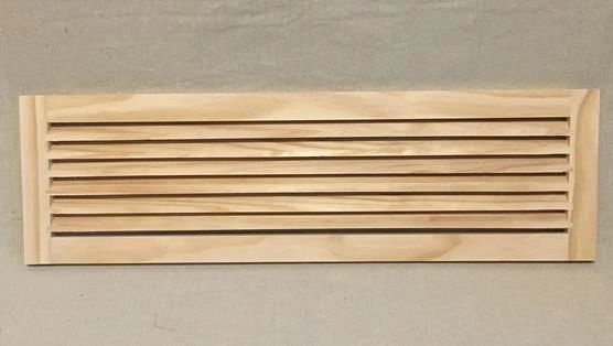 A wooden strip with eight pieces of wood.