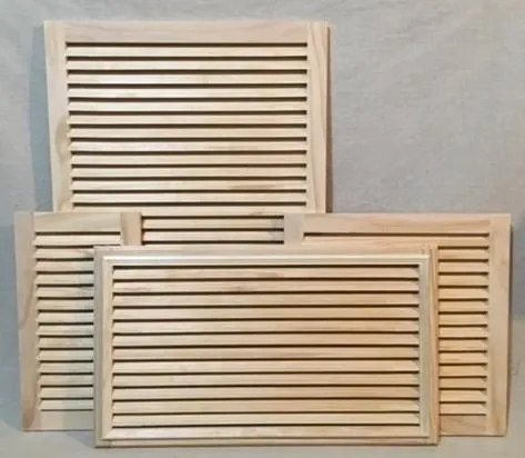 A set of four wooden vents on the wall.